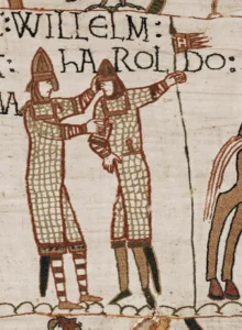 Willem en Harold in maliënkolder. De kolder reikt tot de knie en is aan de voorzijde gespleten om te paard te kunnen zitten. Tapijt van Bayeux, ca. 1070.